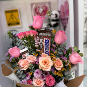 Hermoso arreglo en tonos rosados (  los chocolates son adicionales  )
